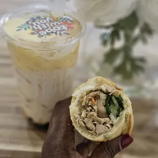 a person holding a sandwich