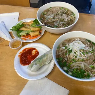 three bowls of food on a table