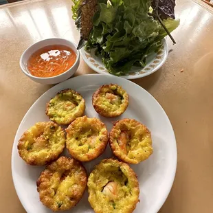 Bánh Khọt, the smaller version of Bánh Xèo (Vietnamese flour crepe) in bite size style in half circle iron mold.
