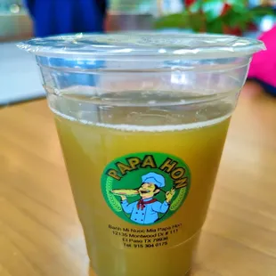 a plastic cup of juice