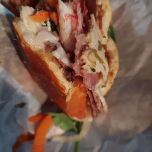 a sandwich with meat and vegetables