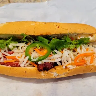 Barbecue pork banh mi with vegetables. Loaded the vegetables with a normal amount because we had extra from another restaurant.