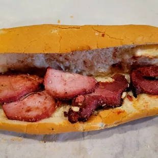 Barbecue pork banh mi. That's all the meat you get. Baguette is cracked in many areas