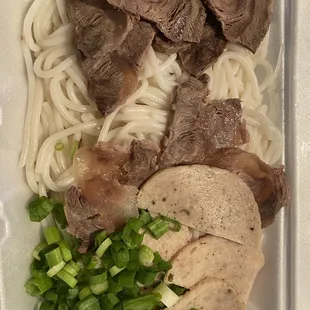 Bun bo hue to-go box. Missing blood cube and pork knuckle in the broth