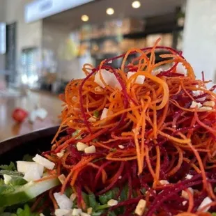 a salad with carrots and onions