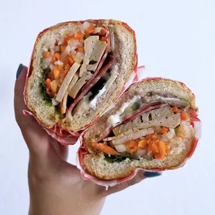Bánh Mì Dặc Biệt "Combo" - Head cheese, fancy pork, roasted cinnamon pork, pâté, pickled veggies, egg butter, jalapeño | $10
