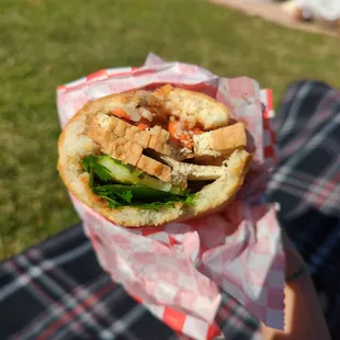 Cross section of tofu banh mi, they scooped the insides out so there's not any bread left aside for the crispy exterior. Dry tofu.