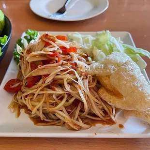 a plate of food and a bowl of salad