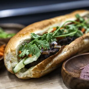 a sandwich with meat and vegetables