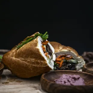 a sandwich cut in half on a cutting board