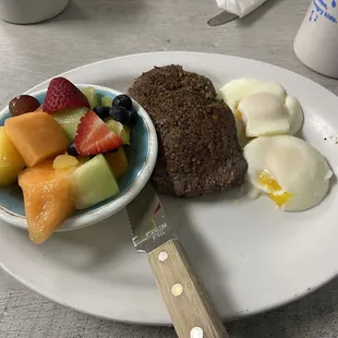 Sirloin steak, eggs, and fruit