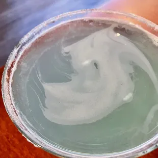 a close up of a glass of liquid