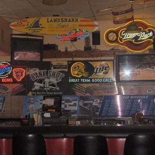 neon signs above the bar