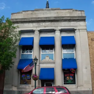 a car parked in front of a bank