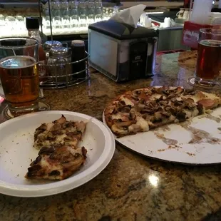 Chicken Alfredo pizza with Canadian bacon and mushrooms.