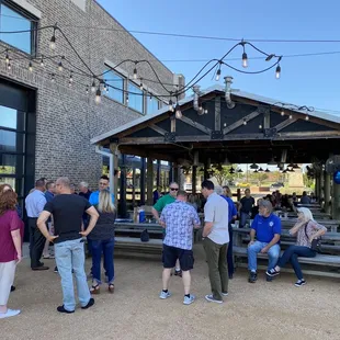 a group of people standing outside of a building