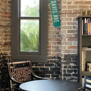 a table and chairs in front of a window