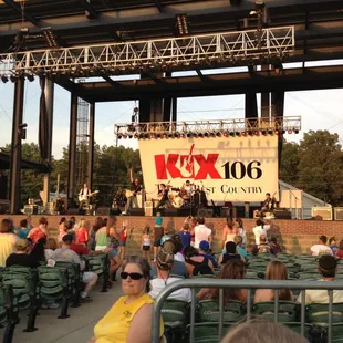 a crowd of people sitting in the bleachers