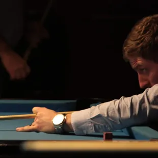 a man playing pool
