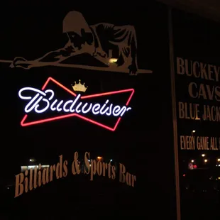 a neon sign in the window