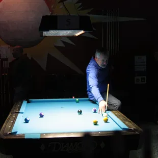 a man playing pool