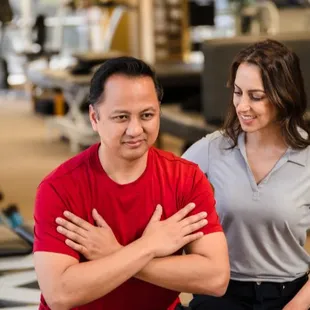 Therapist helping patient with exercise
