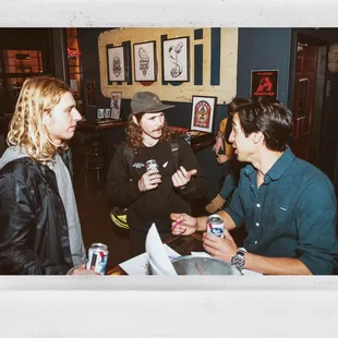 a group of men having a conversation