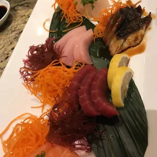 a plate of sashimi
