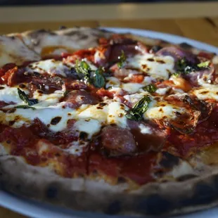 SOPPRESSATA pizza with tomato, mozzarella, and spicy honey.