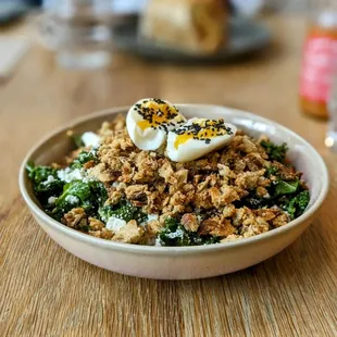 Lemon Kale Salad plus soft egg - bright, acidic, delicious! @bilalandjesseatfood