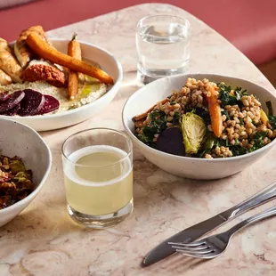 three bowls of food on a table