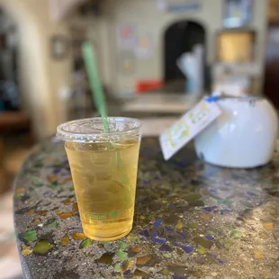 a glass of tea on a table
