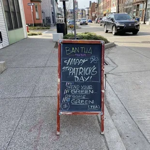 a sign on the sidewalk