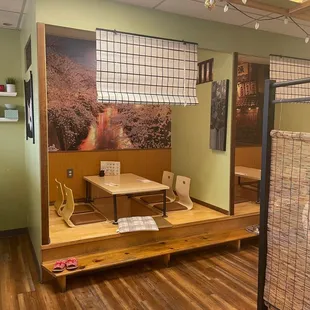 The cute indoor traditional tables and seating on elevated floors.