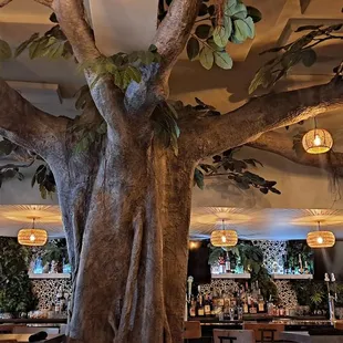 Faux tree in the center of the restaurant.