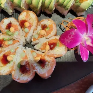 Check out that salmon flower roll. To die for yumminess. The other one is the mango tango.  Also so freakn yummy.