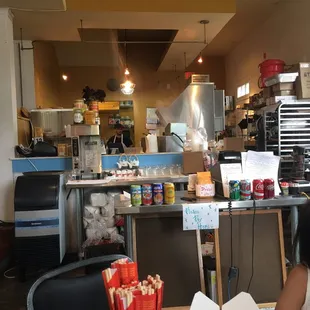 a woman sitting at a table in a restaurant