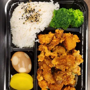Popcorn chicken lunch box - broccoli, rice, tea egg, and daikon. Amazing portions!