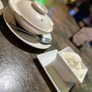 a plate of rice and a bowl of rice