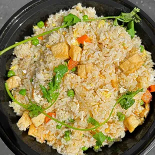 a bowl of fried rice and vegetables