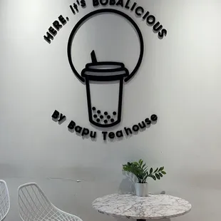 a table and chairs in a coffee shop