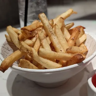 a bowl of fries and ketchup