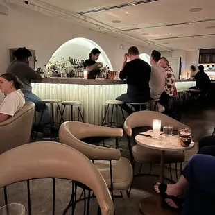 a group of people sitting at a bar