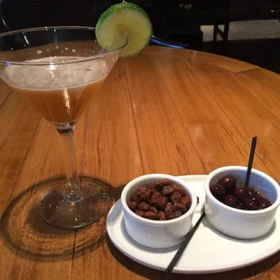 Burnt Sugar Dacquiri ($16) with complementary bar snacks of marinated olives (warning: there are pits) &amp; spiced pistachios. Yum.