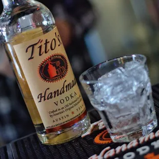 a bottle of alcohol and a glass of ice