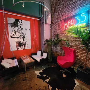 lounge area with neon sign