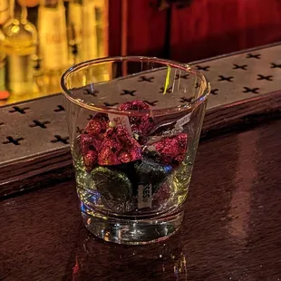 raspberries in a glass of water
