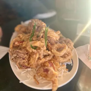 a plate of fried squids and a glass of beer