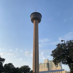 a tall tower in a parking lot
