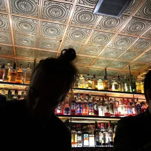 a woman and a man at a bar